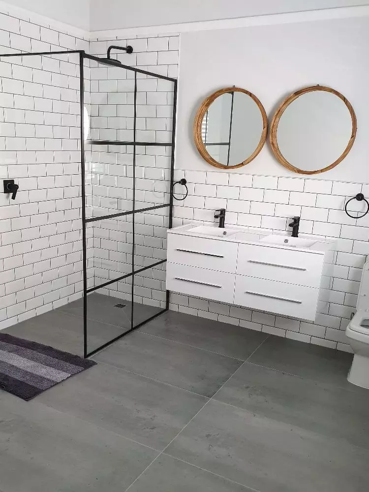 Complete bathroom renovation featuring contemporary finishes, a new vanity and upgraded shower area.