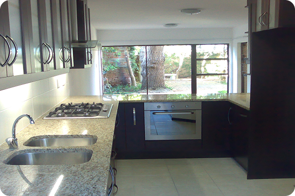 Modern kitchen renovation with island and premium finishes